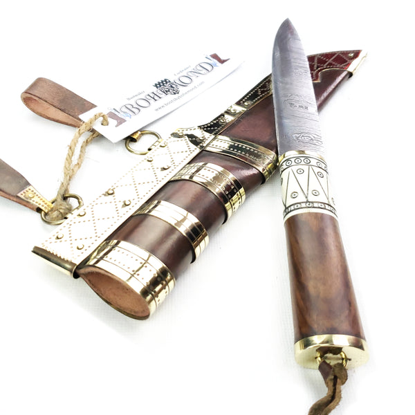 Handle of Rus Viking Damascus Knife #56A is a replica Viking Knife with decorated Sheath and features Norse decorative motifs carved in the bone handle accented with brass, and a Damascus blade that is sturdy and beautiful.