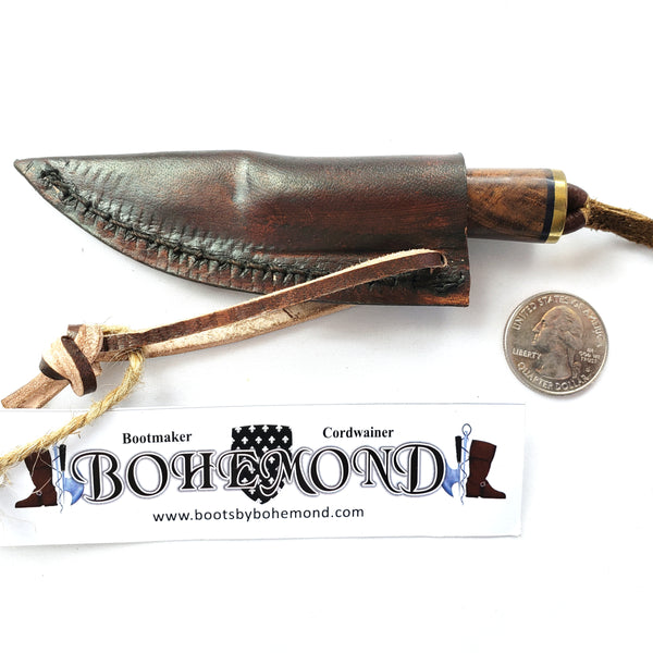The Fibula Norse Seax is small with tool steel blade Rosewood handle Vegetable-tanned leather sheath.  A great addition to Viking Boob Bling and a Viking belt knife too!