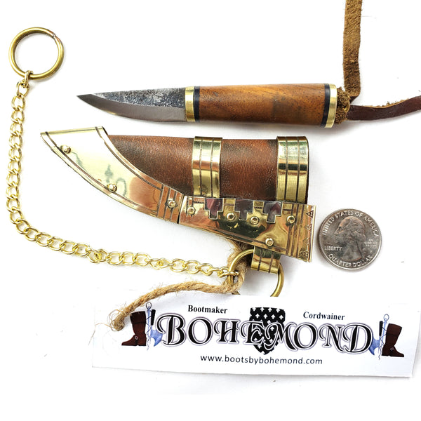 Viking Boob Bling, The Fibula Norse Seax with Chain is a small and robust tool steel blade sturdy and beautiful with a Rosewood handle with brass.   Decorated vegetable tanned leather sheath with Norse Viking brass and silver historical ornamentation