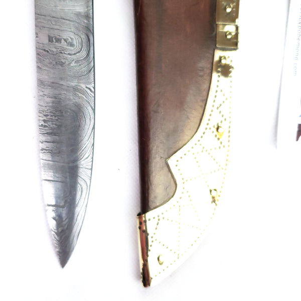Tip close up Rus Viking Damascus Knife #56A is a replica Viking Knife with decorated Sheath and features Norse decorative motifs carved in the bone handle accented with brass, and a Damascus blade that is sturdy and beautiful.