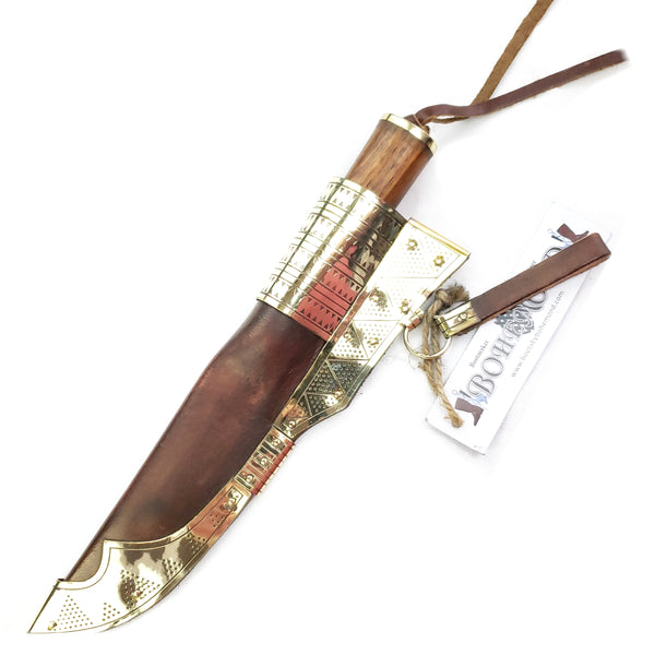 I sheath Rus Viking Damascus Knife #56D is a replica Viking Knife with decorated veg tanned with brass decorations Sheath and features Norse decorative motifs carved in the bone handle accented with brass, and a Damascus blade that is sturdy